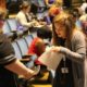 Public and private high school students in 10th through 12th grade trade business cards at the first South Carolina Leadership Conference Wednesday at Lander University.